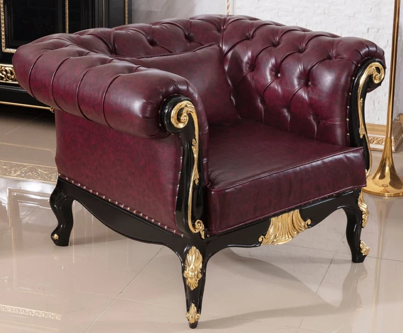 Casa Padrino Luxus Barock Chesterfield Sessel Bordeauxrot / Schwarz / Gold - Prunkvoller Wohnzimmer Sessel mit edlem Kunstleder - Barock Chesterfield Wohnzimmer Möbel