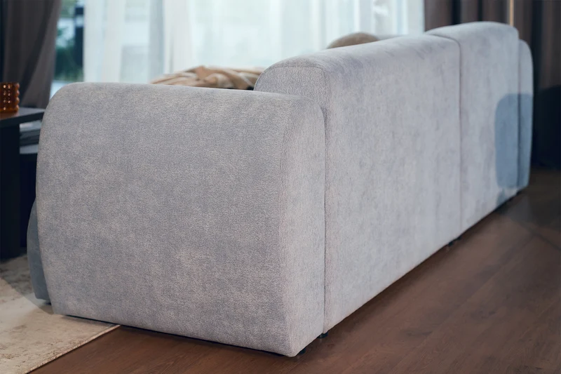 Ecksofa mit Schlaffunktion Emia, L-förmig, linksseitig, hellblauer Chenille-Bezug