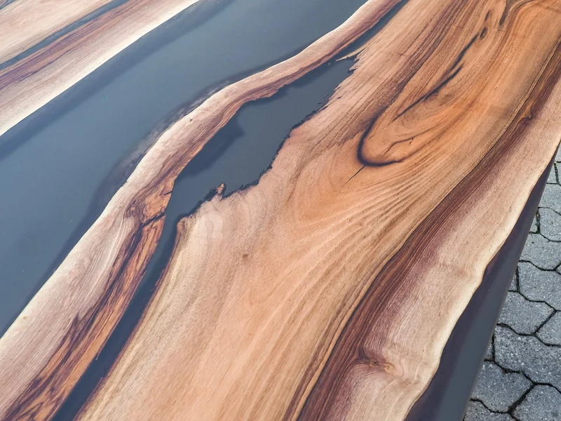 Neo - Epoxidharz Esstisch aus Nussbaum mit schwarzem Harz