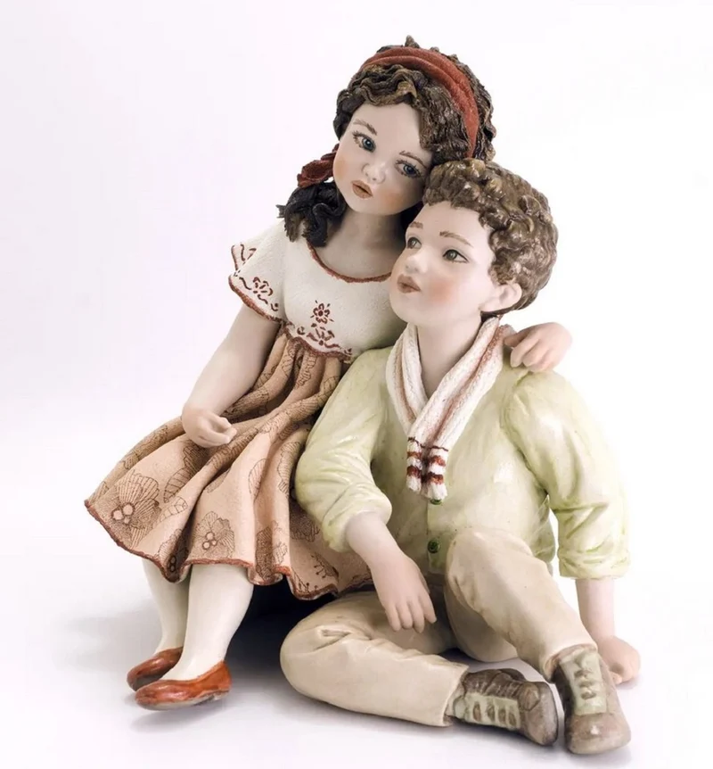 Casa Padrino Porzellan Deko Puppen Skulptur Junge & Mädchen H. 22,5 cm - Made in Italy
