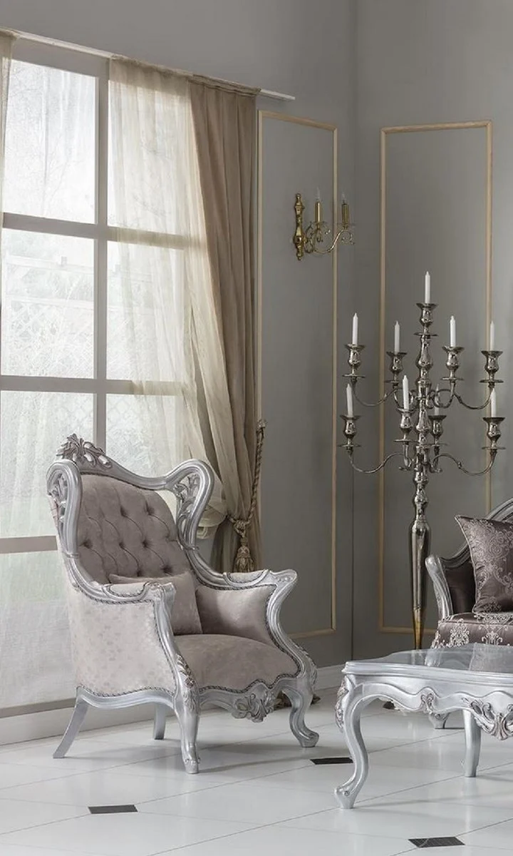 Casa Padrino Luxus Barock Ohrensessel Champagnerfarben / Silber 85 x 80 x H. 120 cm - Prunkvoller Wohnzimmer Sessel mit dekorativem Kissen - Barock Möbel